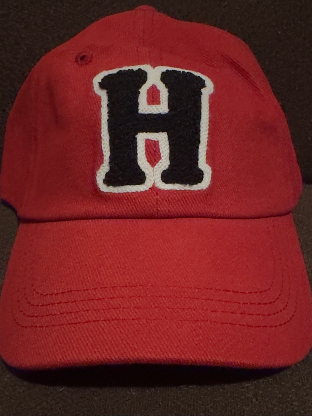 Brand New With Tags Men’s Red Baseball Cap with Black 'H' Patch.